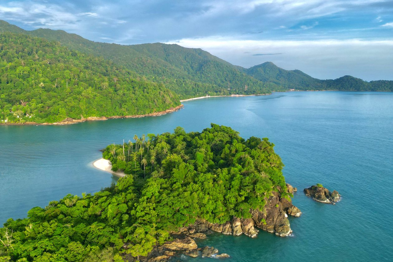 Drone view of Koh Chang rainforest, sheltered bay and tropical coastline near Lonely Beach